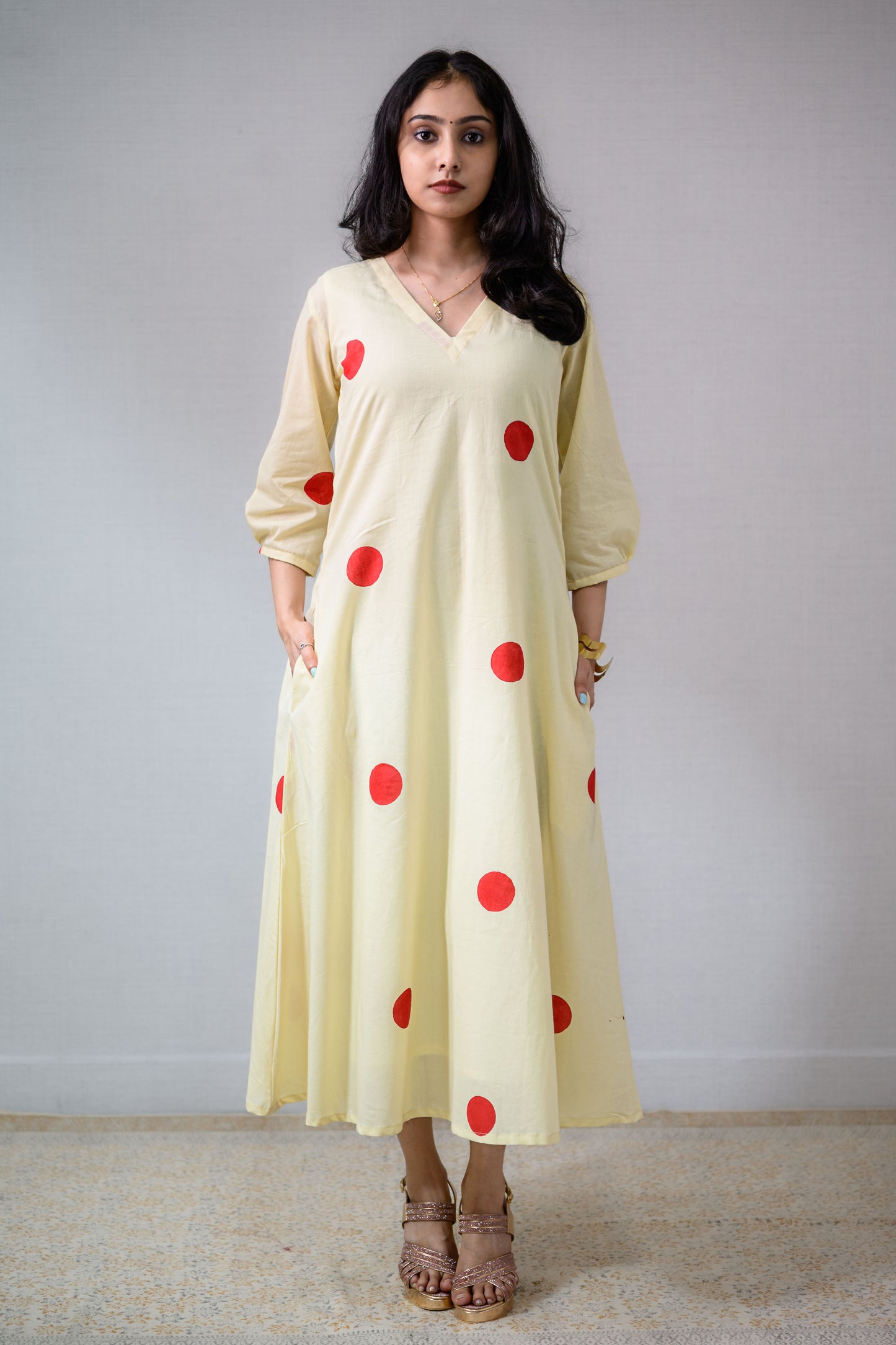Red Polkas on Cream Dress