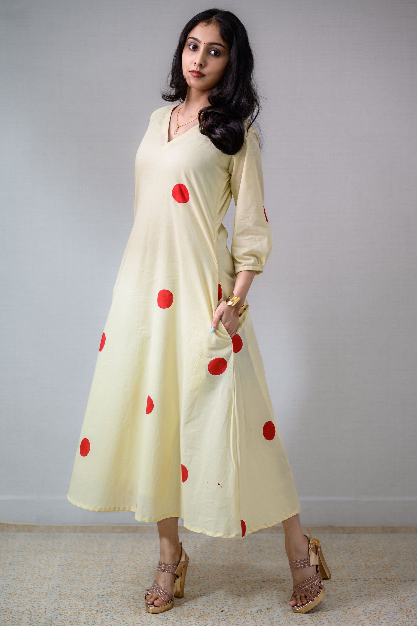 Red Polkas on Cream Dress