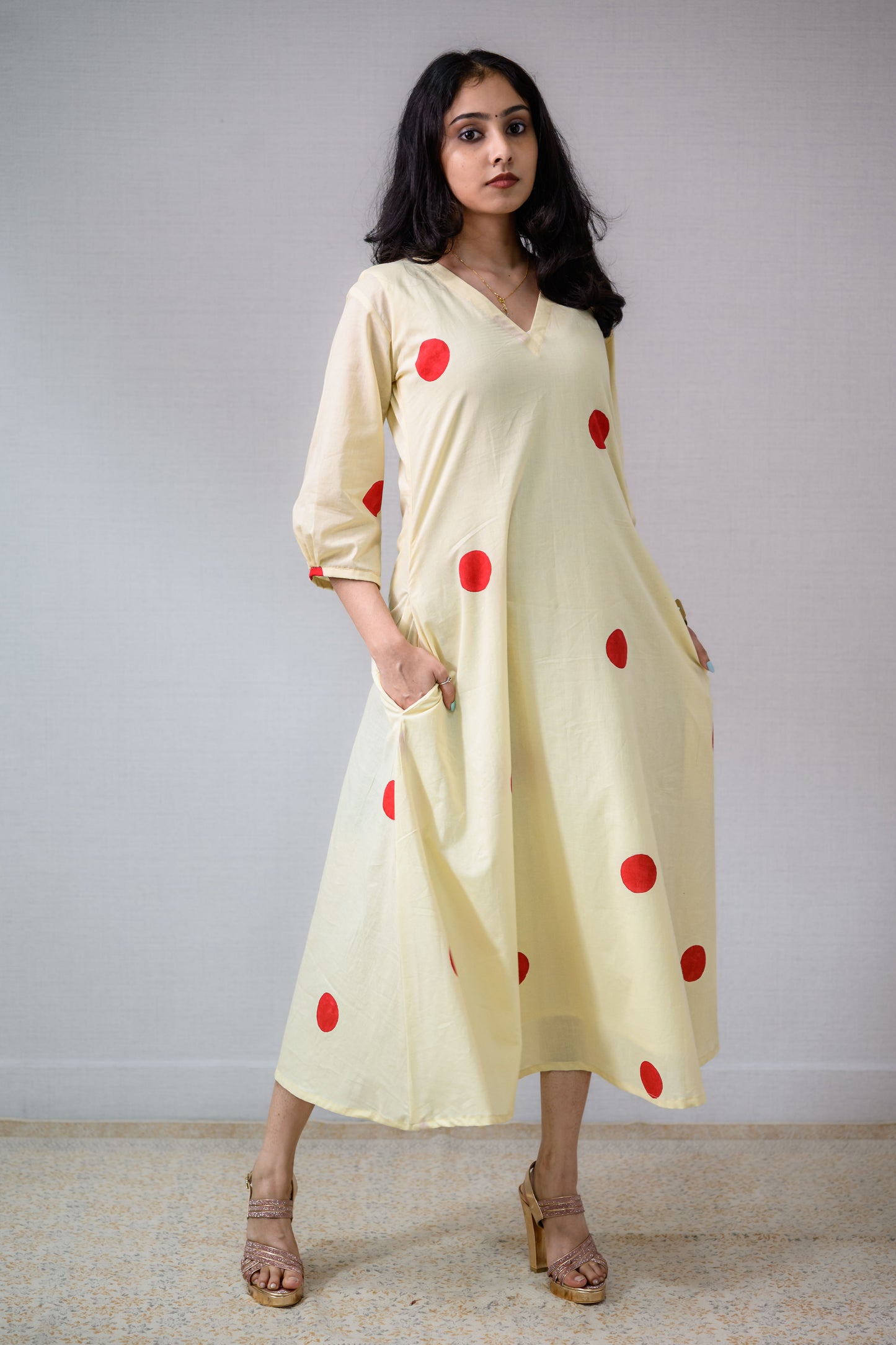 Red Polkas on Cream Dress