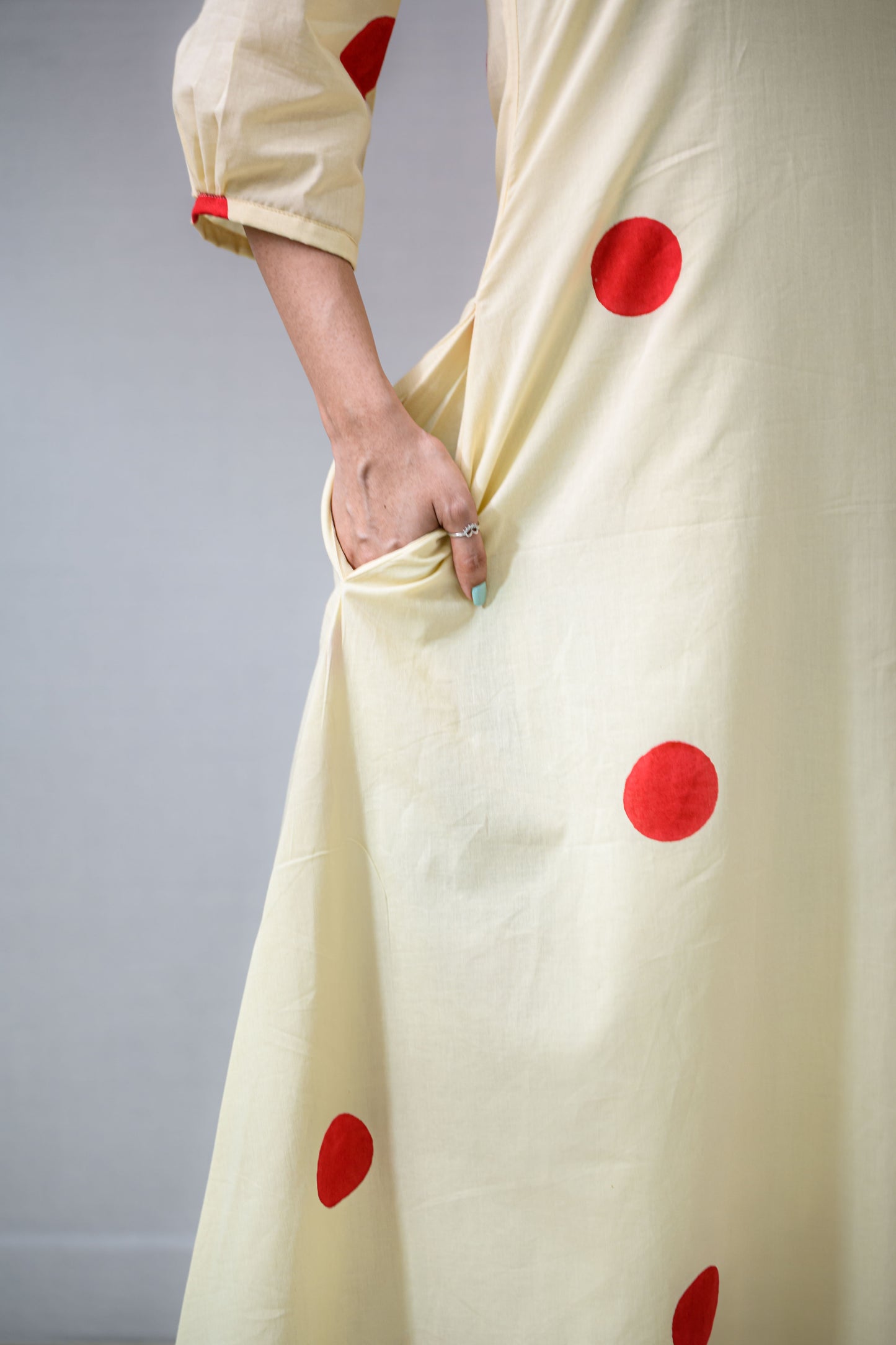 Red Polkas on Cream Dress