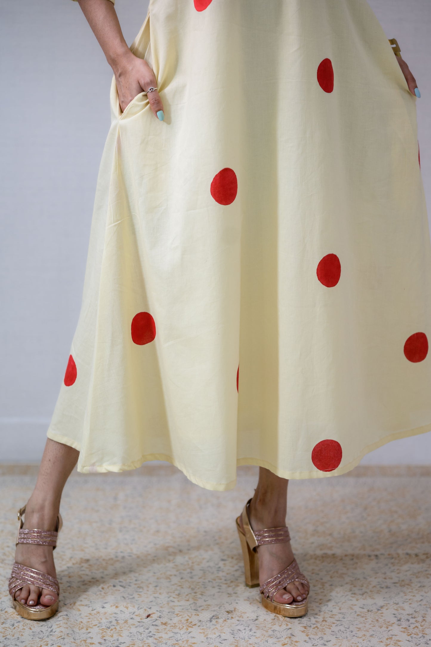 Red Polkas on Cream Dress