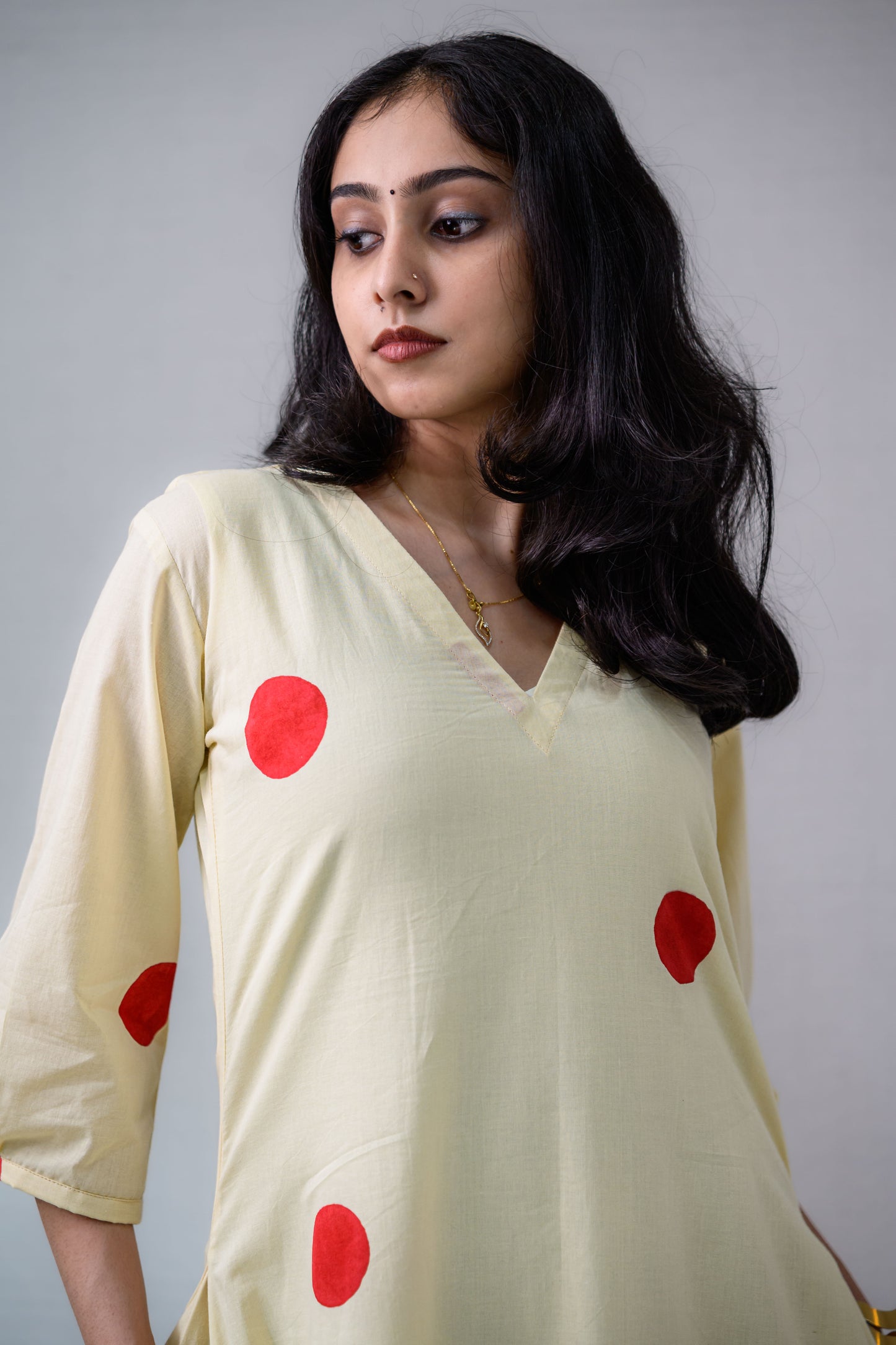 Red Polkas on Cream Dress