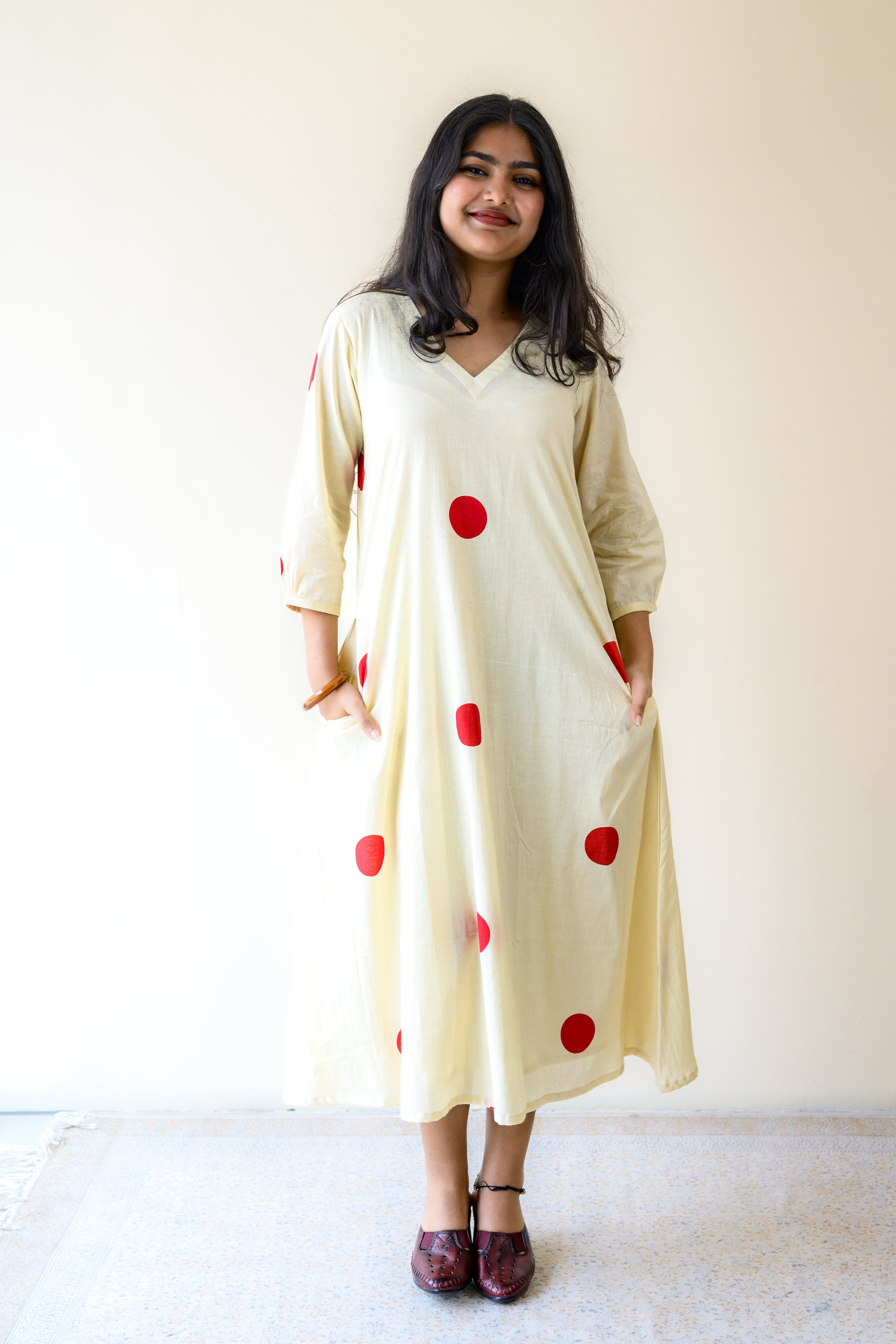 Red Polkas on Cream Dress
