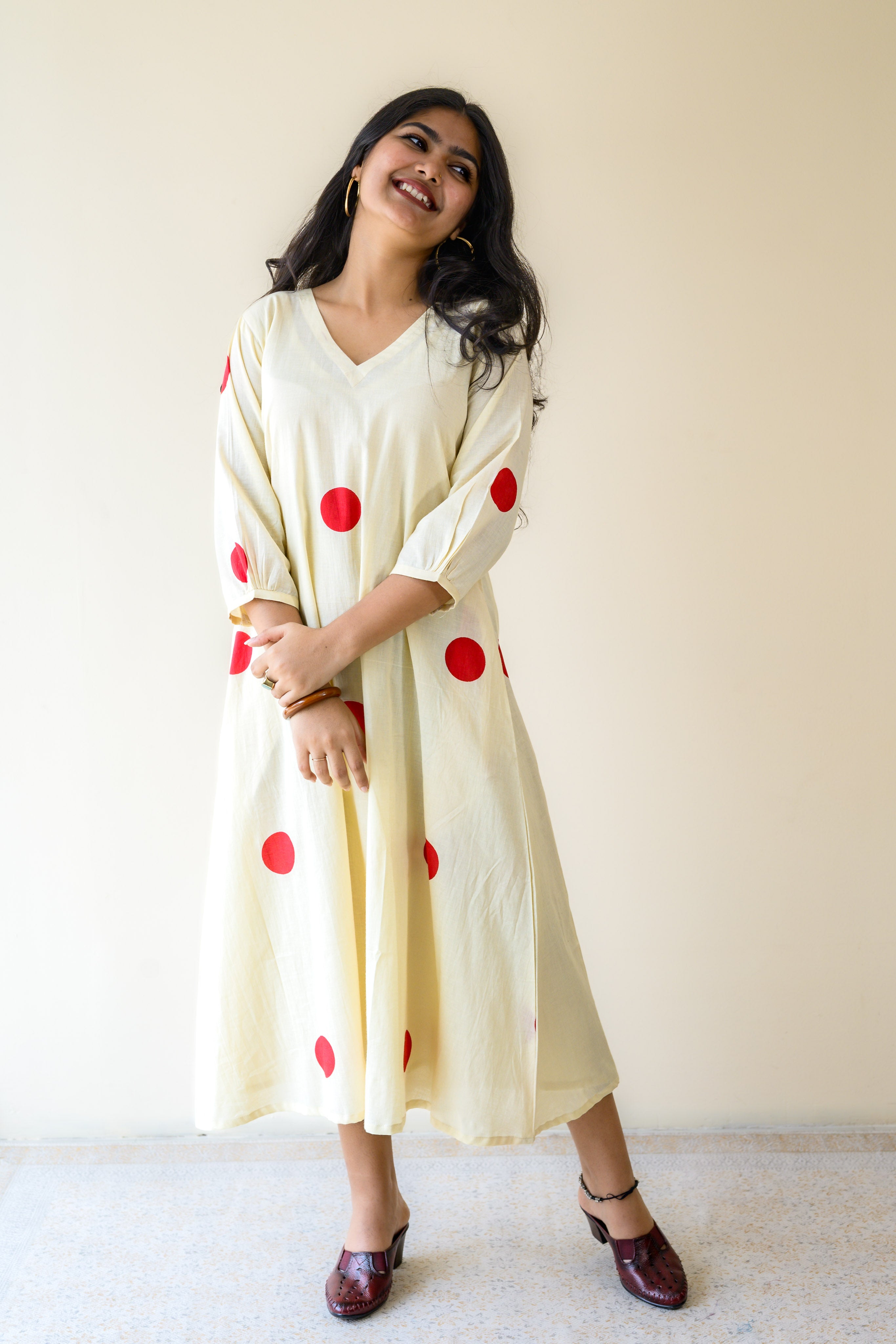 Red Polkas on Cream Dress