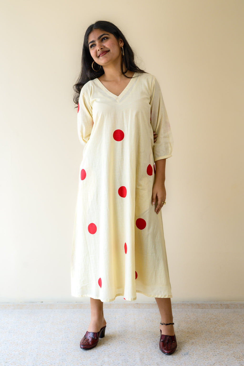 Red Polkas on Cream Dress