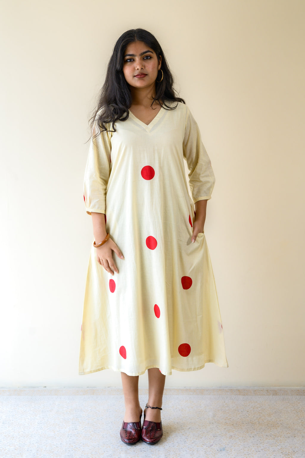 Red Polkas on Cream Dress