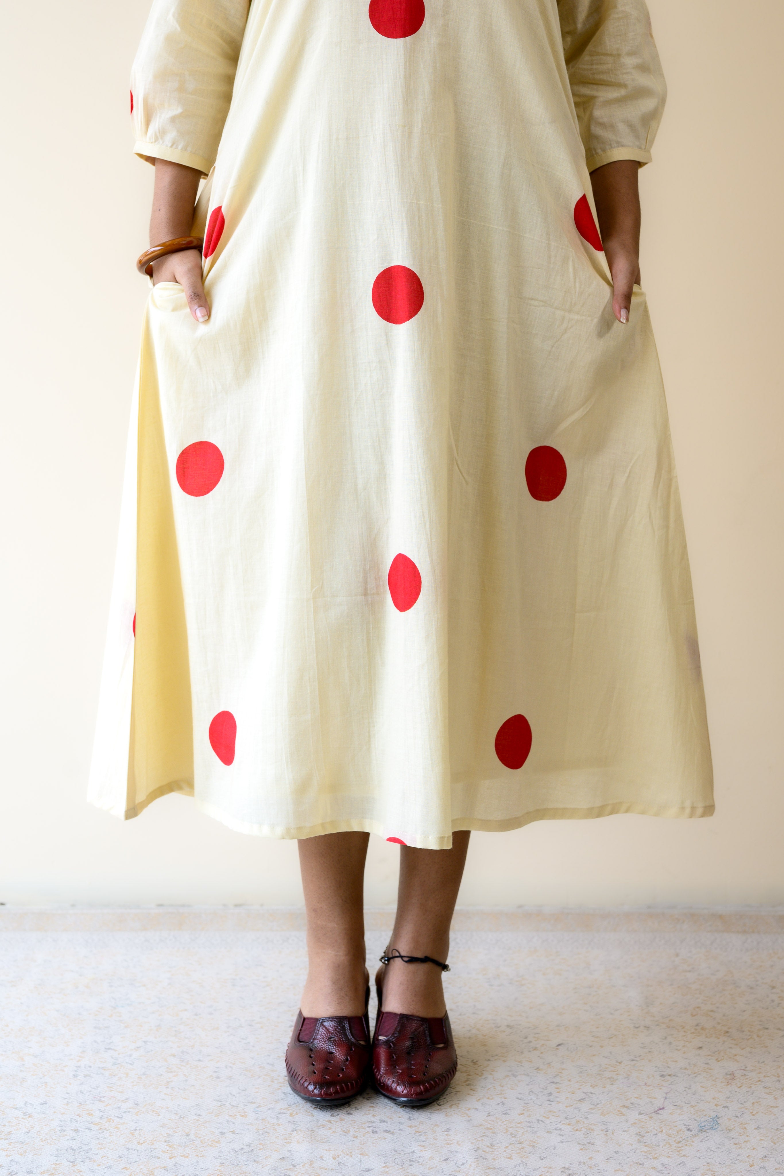 Red Polkas on Cream Dress