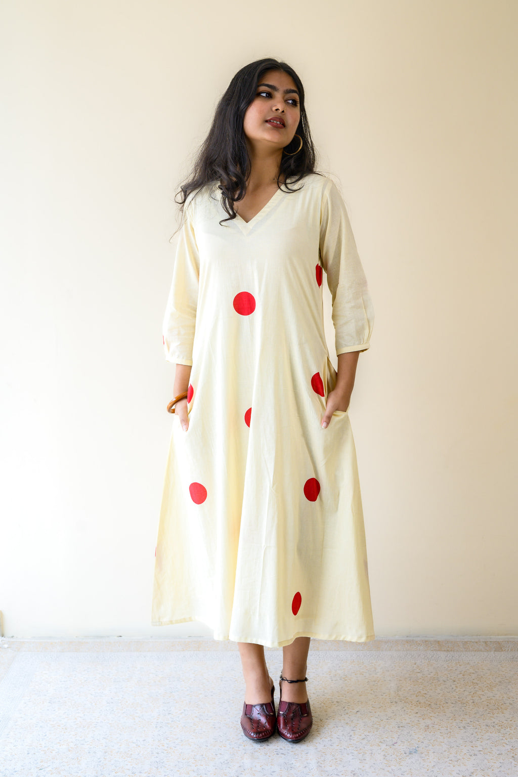 Red Polkas on Cream Dress