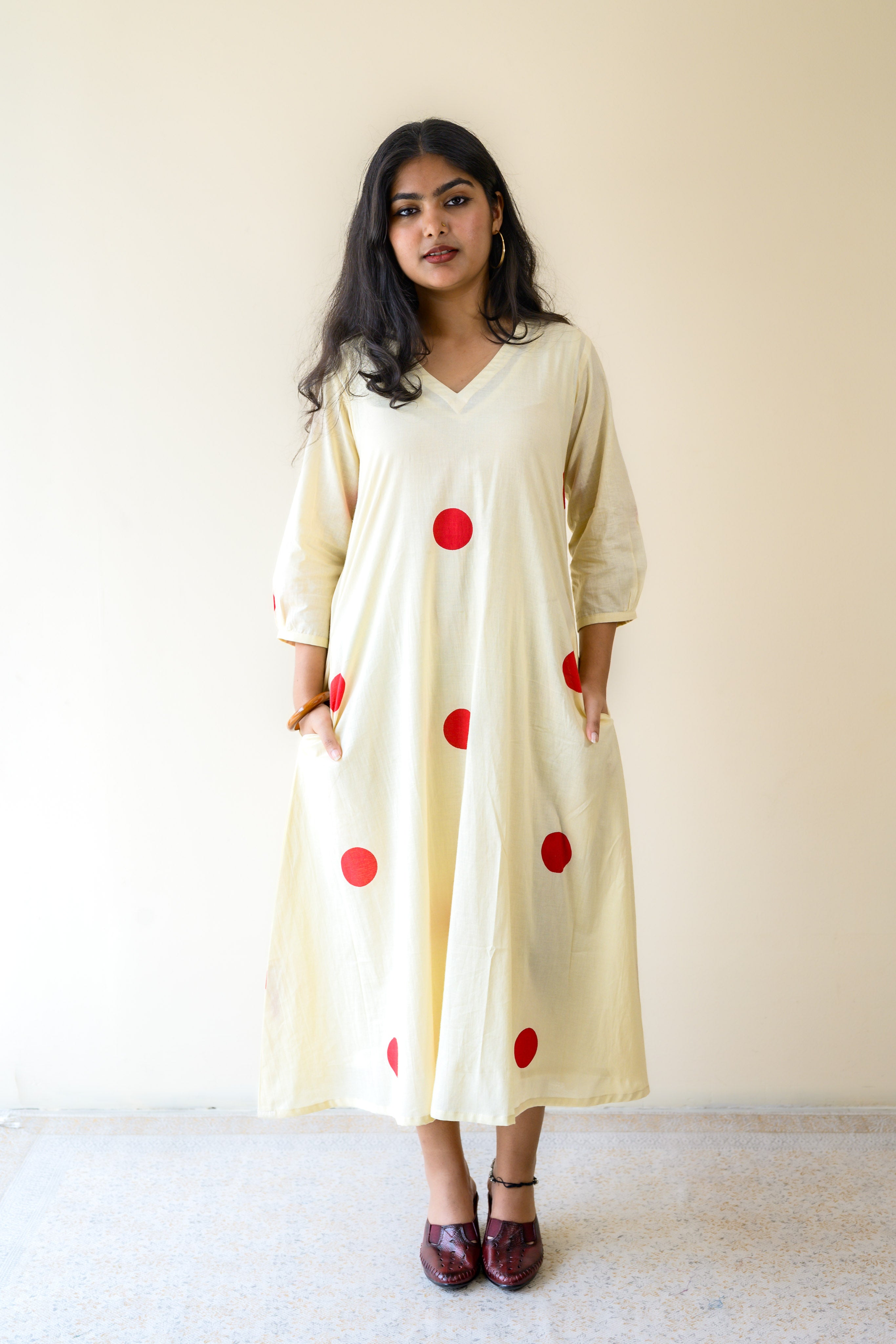 Red Polkas on Cream Dress
