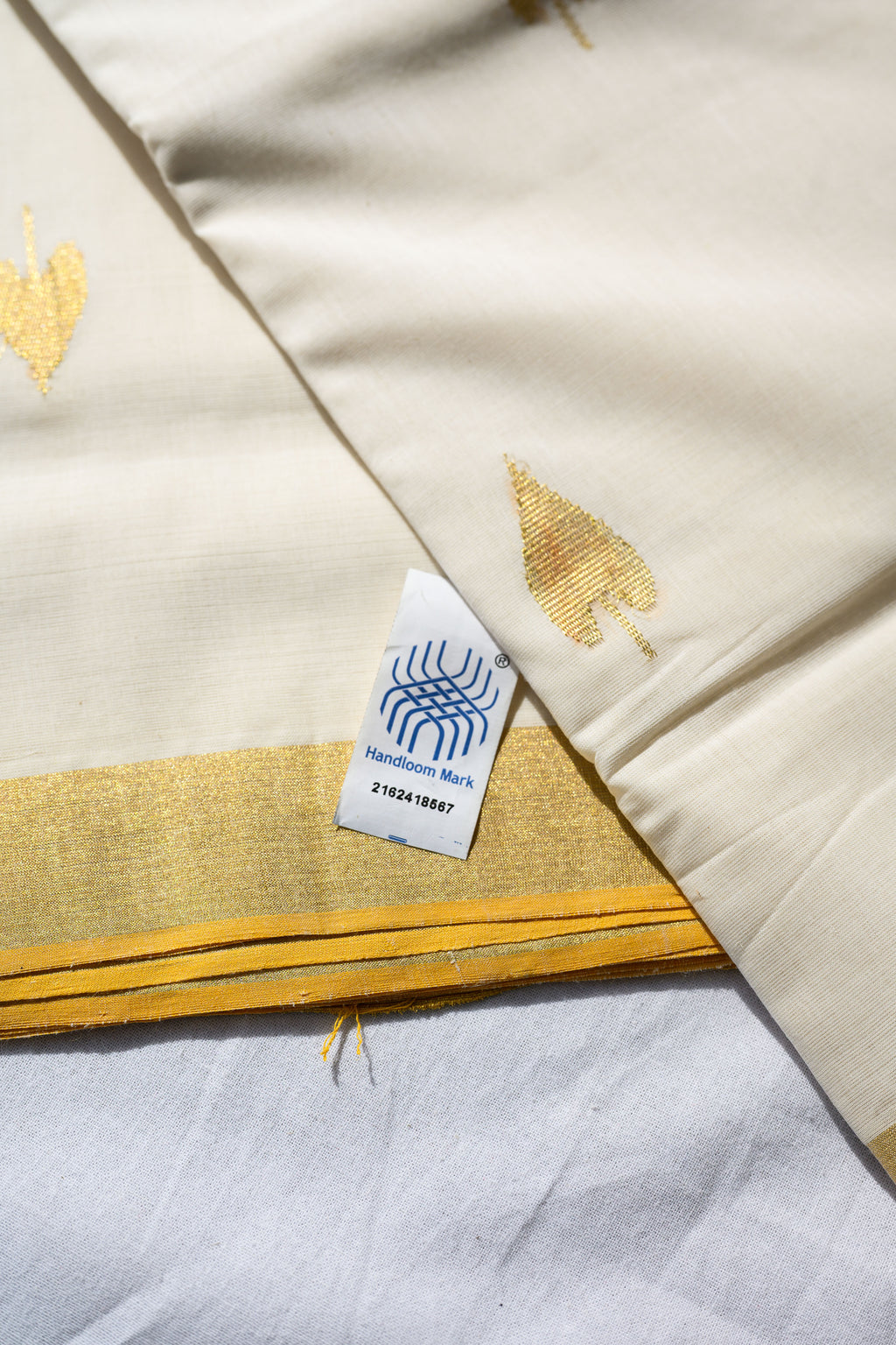 Golden Kasavu Butas Balaramapuram Handloom Saree with Modal Ajrakh Blouse