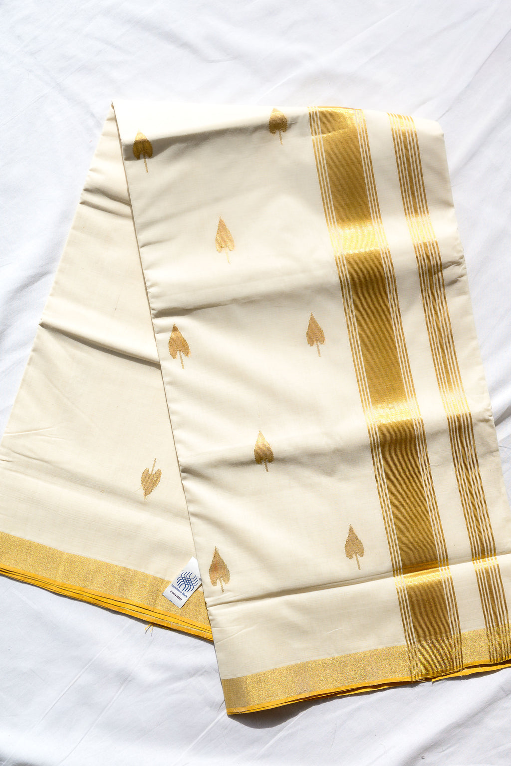 Golden Kasavu Butas Balaramapuram Handloom Saree with Modal Ajrakh Blouse