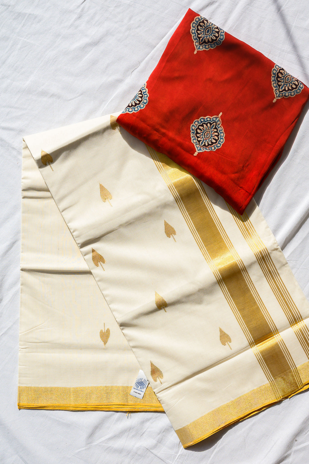 Golden Kasavu Butas Balaramapuram Handloom Saree with Modal Ajrakh Blouse