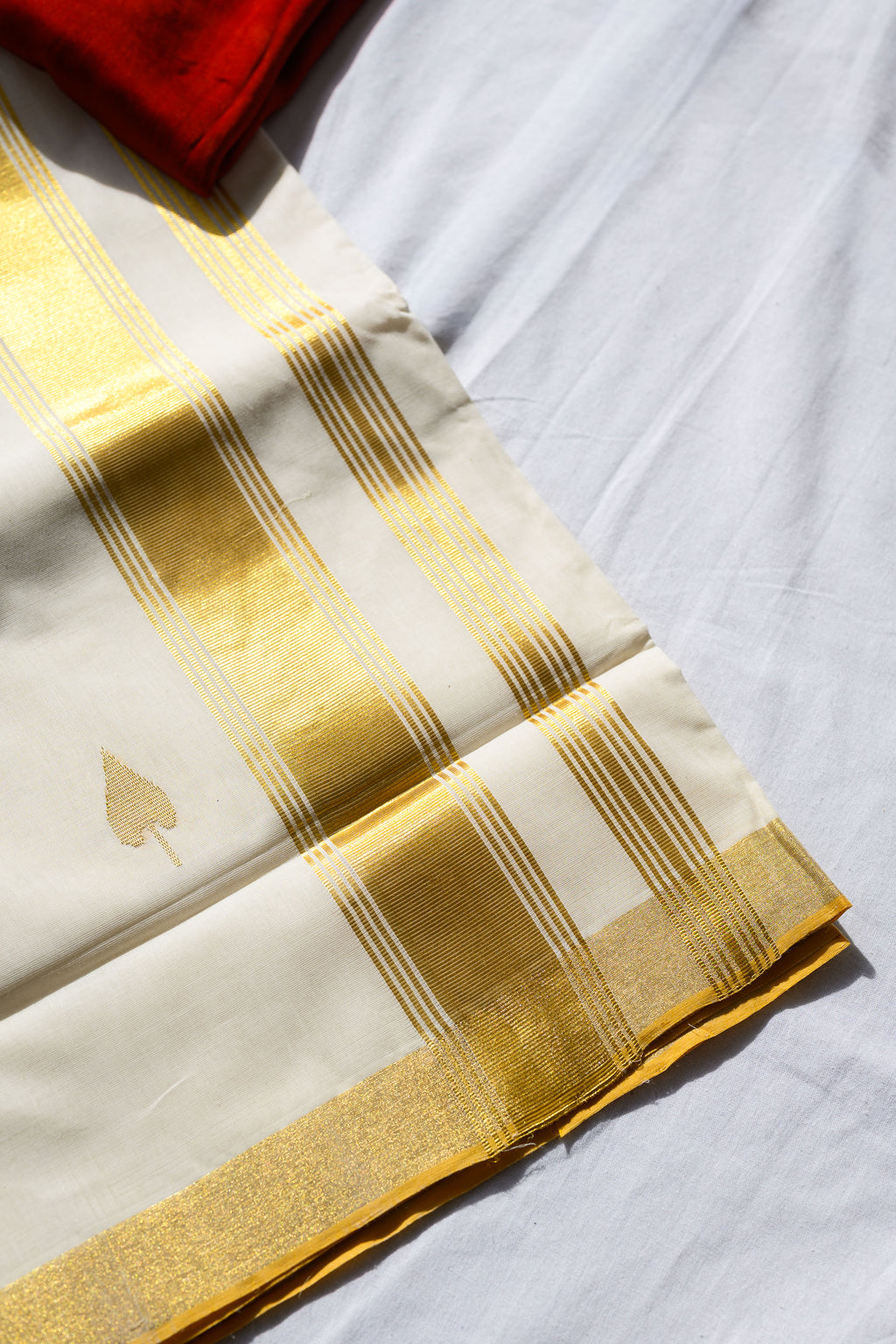 Golden Kasavu Butas Balaramapuram Handloom Saree with Modal Ajrakh Blouse