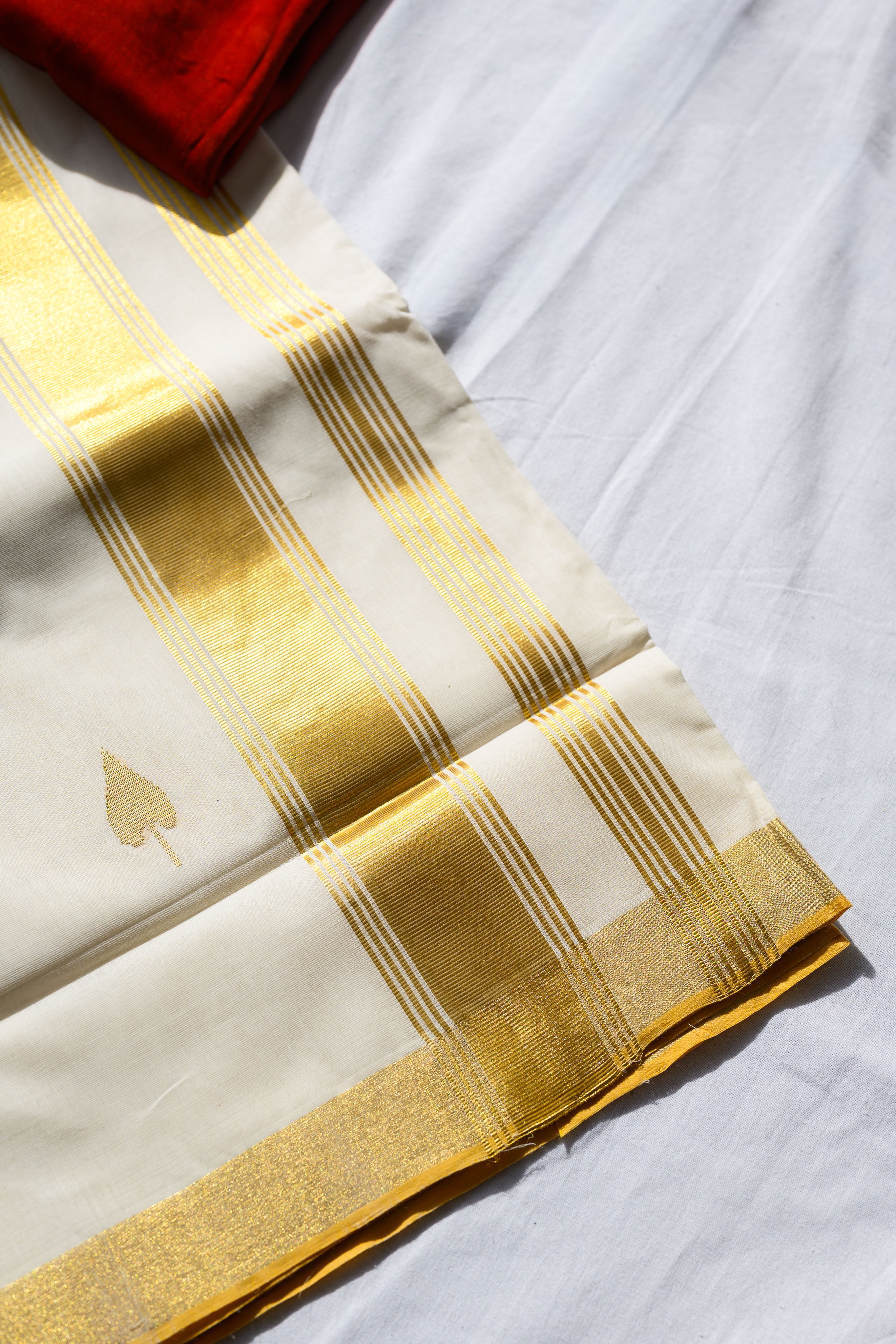 Golden Kasavu Butas Balaramapuram Handloom Saree with Modal Ajrakh Blouse