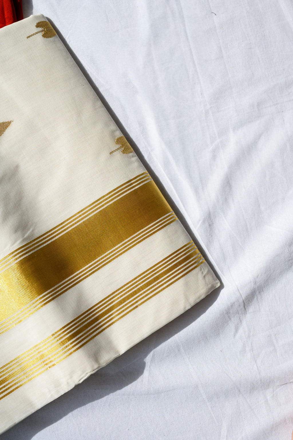 Golden Kasavu Butas Balaramapuram Handloom Saree with Modal Ajrakh Blouse