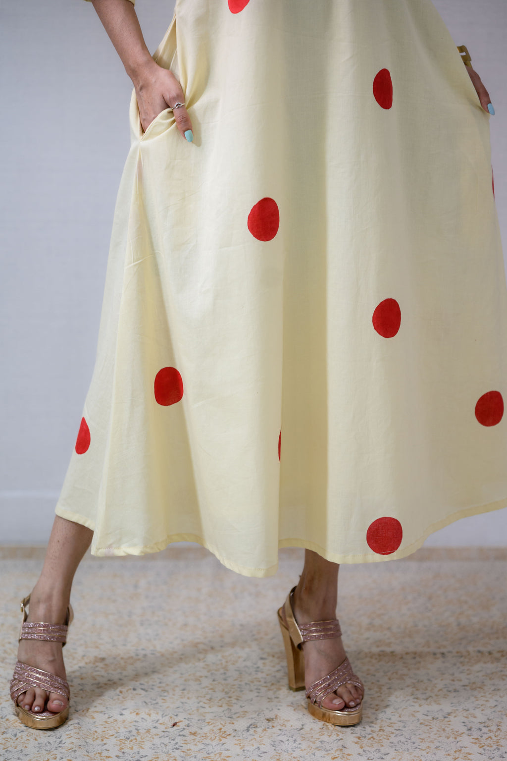 Red Polkas on Cream Dress