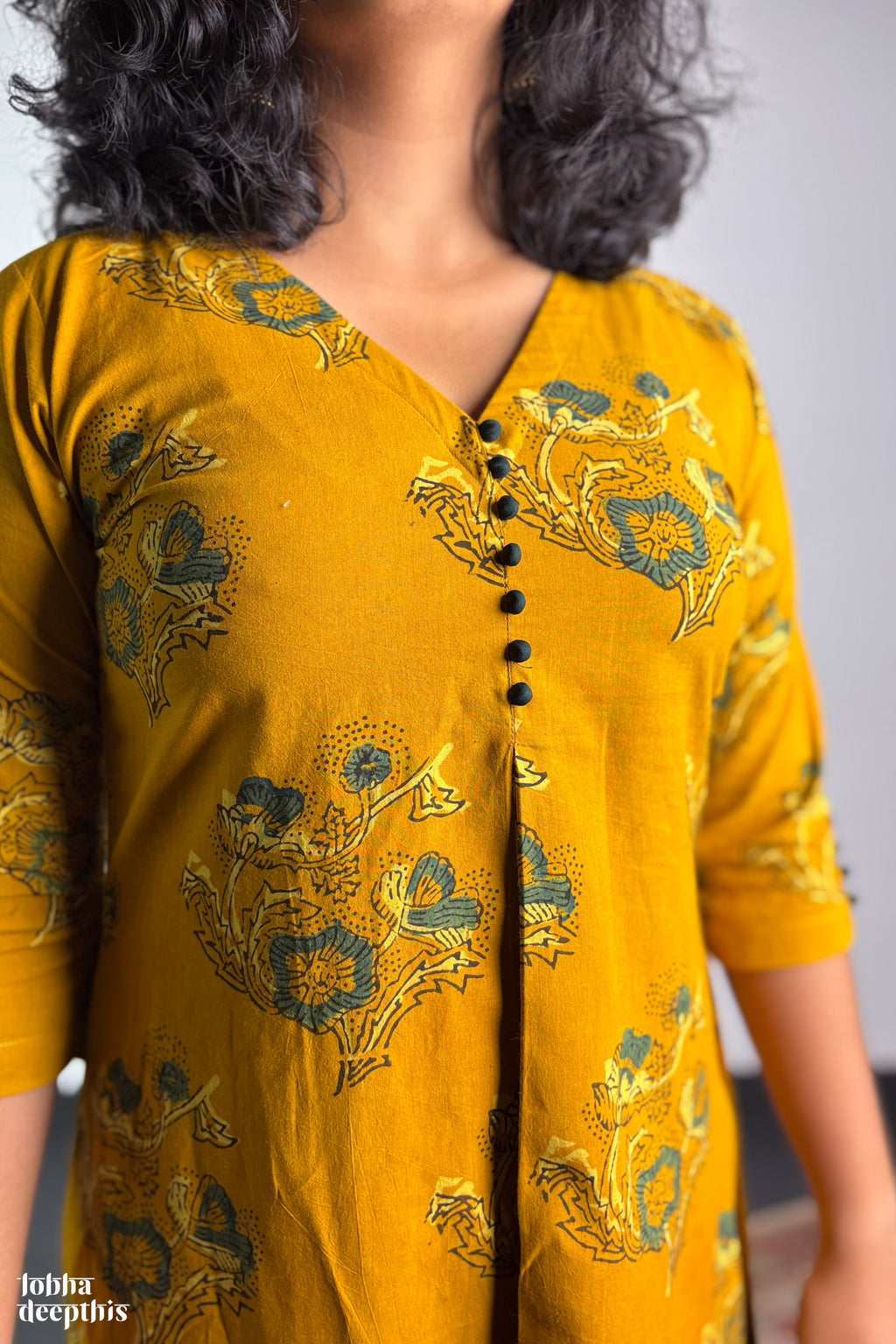 Ajrakh Blooms on Turmeric Box Pleated Dress