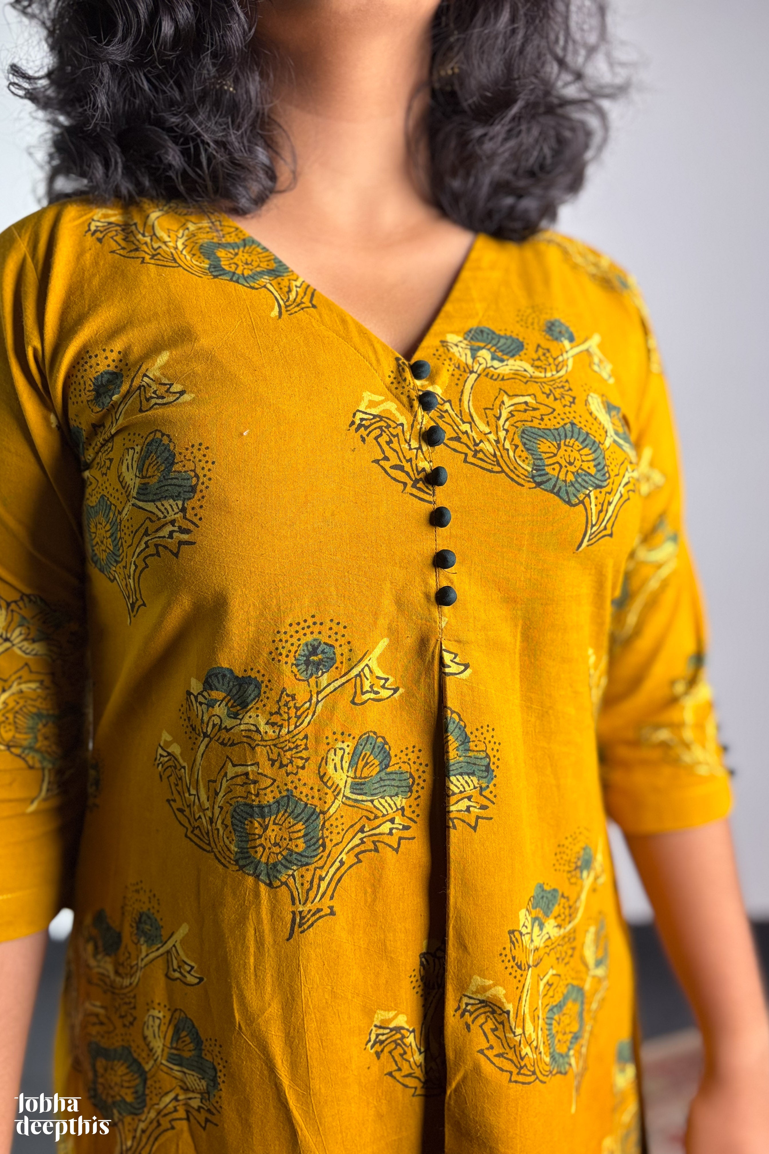 Ajrakh Blooms on Turmeric Box Pleated Dress
