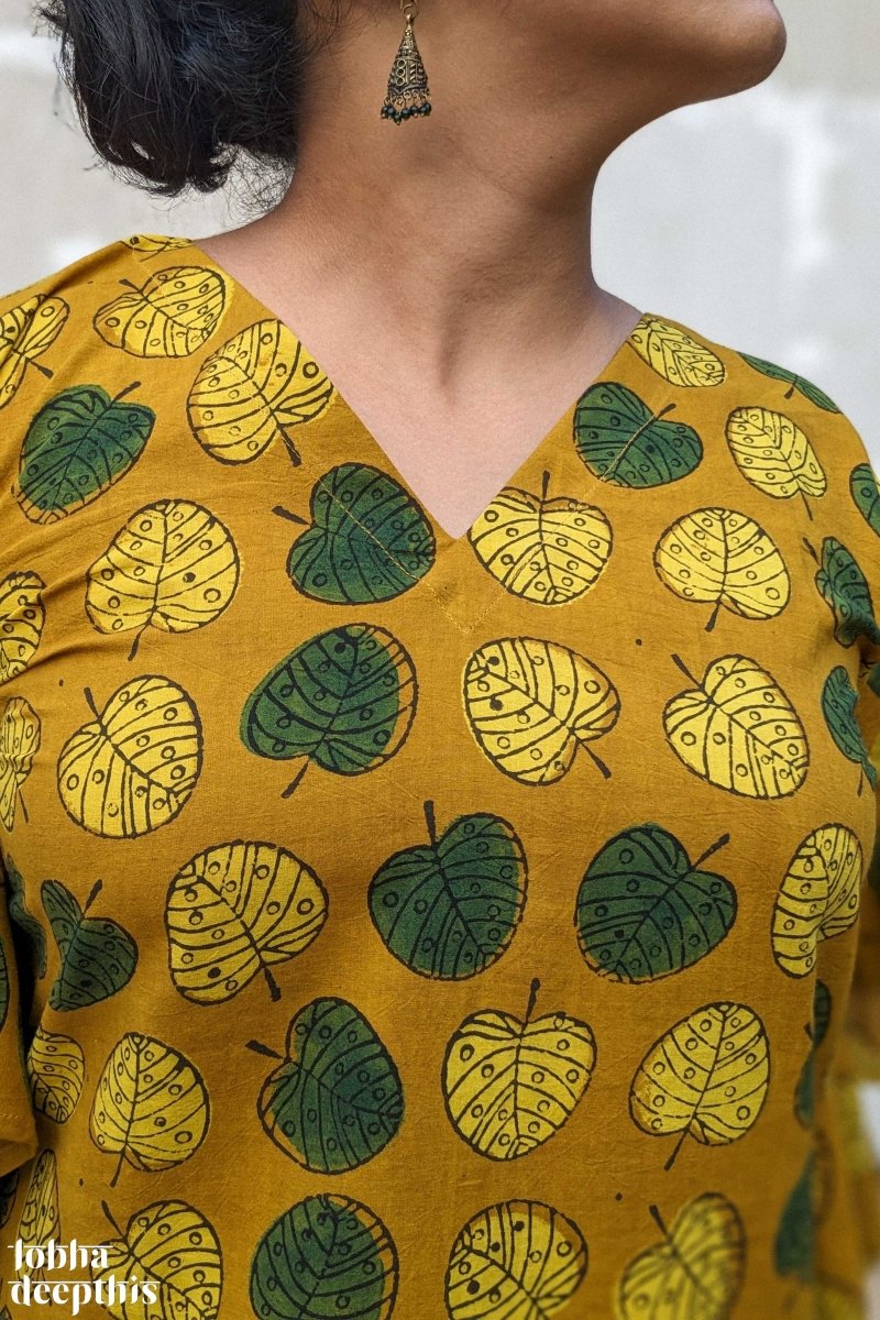 Ambal Leaves on Turmeric Ajrakh Kaftan - Lobha Deepthis