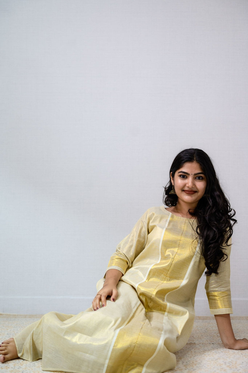 Kasavu Elegance Golden Tissue High Low Flared Kurta- Lobha Deepthis Kasavu Elegance Golden Tissue High Low Flared Kurta- Lobha Deepthis