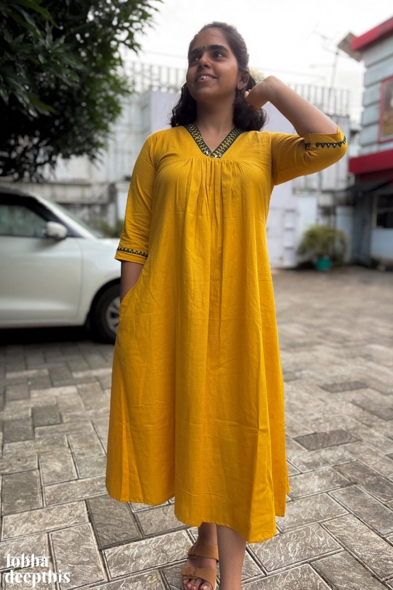 Mirrors on Mustard Dress - Lobha Deepthis