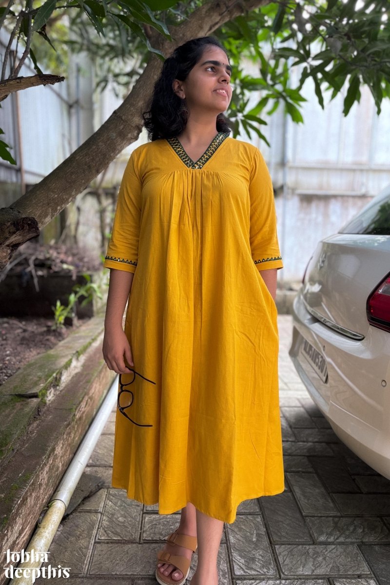 Mirrors on Mustard Dress - Lobha Deepthis