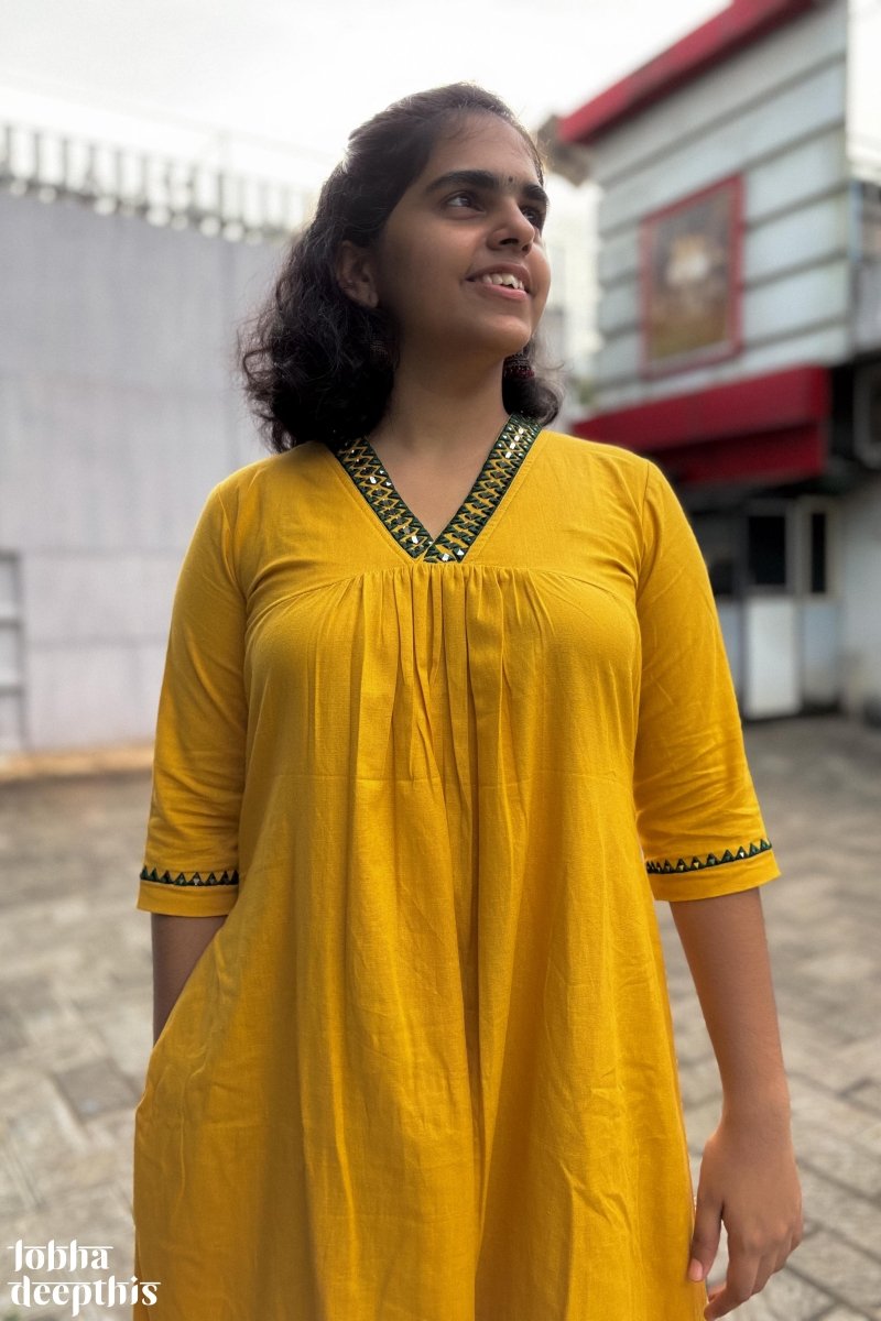 Mirrors on Mustard Dress - Lobha Deepthis