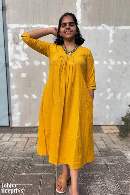 Mirrors on Mustard Dress - Lobha Deepthis