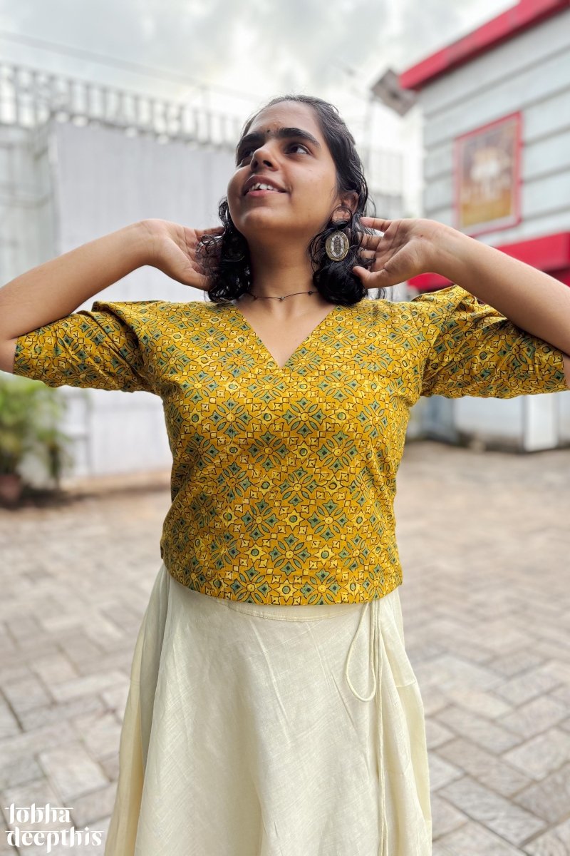 Turmeric Ajrakh and Golden Tissue Onam Skirt Top Set Lobha Deepthis